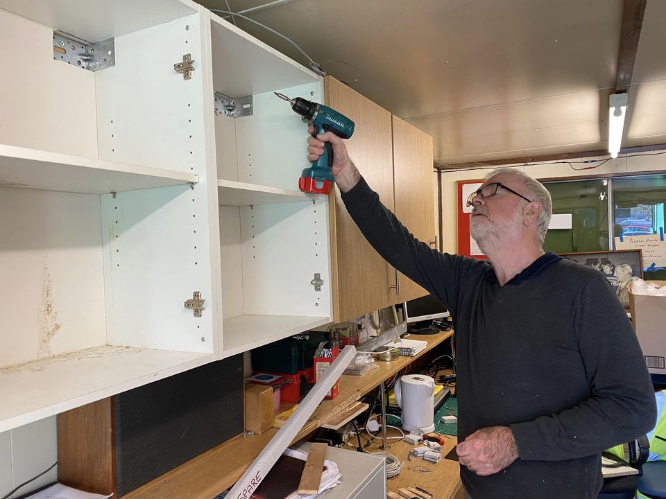 Peter fitting cupboards