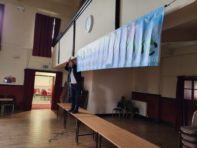 Banner going up
Tom putting main hall banner up
