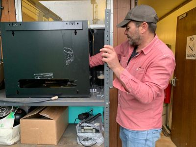 Dave installing repeater cabinet
