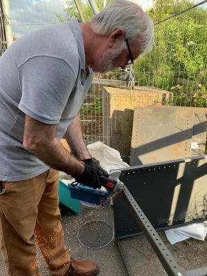 Peter G4WLI
Peter cutting shelving to size with a grinder
